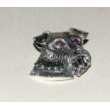 Silver brooch in the form of a dog with ruby eyes and emerald collar