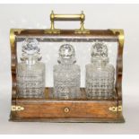 Wooden Tantalus with decanters and key