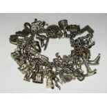 Silver charm bracelet together with 37 charms 110g