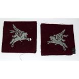 An unused pair of original Parachute Regiment Pegasus embroidered cloth sleeve badges. Moth damage