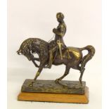 Brass statue of a rider on horseback. 22cm tall