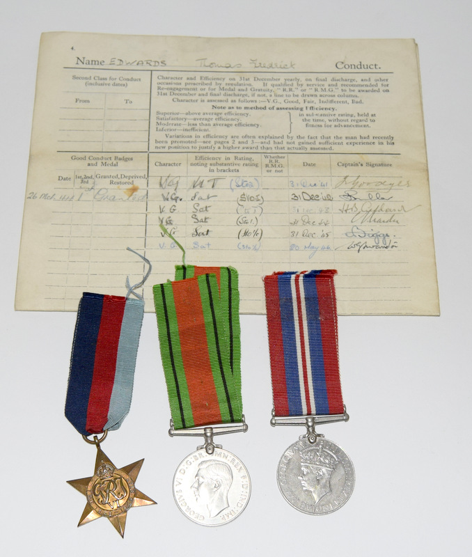 A WW2 Royal Navy Certificate of Service named to Thomas Frederick Edwards with his service medals