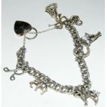 Silver charm bracelet together with 7 charms 42g