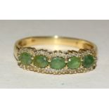 14ct gold ladies diamond and emerald ring size V