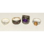 4 good size silver fashion rings