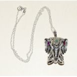 Unusual silver elephant head pendant necklace with ruby eyes