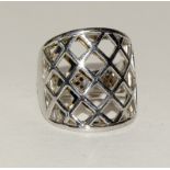 Silver fashion ring with mesh setting and ruby side stone. Size S