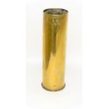 A large polished brass WW2 shell case stick stand 37cms high by 12 cms diameter