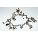 Silver charm bracelet together with 11 charms 33g