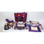 A black leather case full of Masonic aprons - sashes - collars - books and Jewels including some