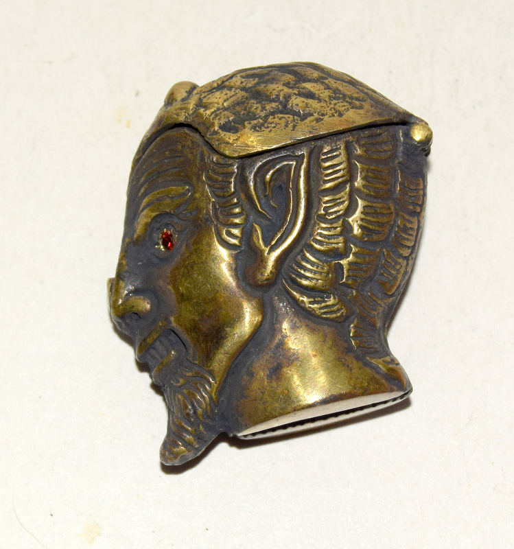 Brass vesta case in the form of a devil's head with glass eyes