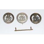 A WW1 Wound Stripe and three WW1 Silver War Badges For Services Rendered numbered B 136565 - B