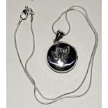 Silver locket with winged fairy to the lid