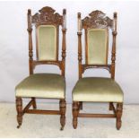 Pair of carved oak hall chairs