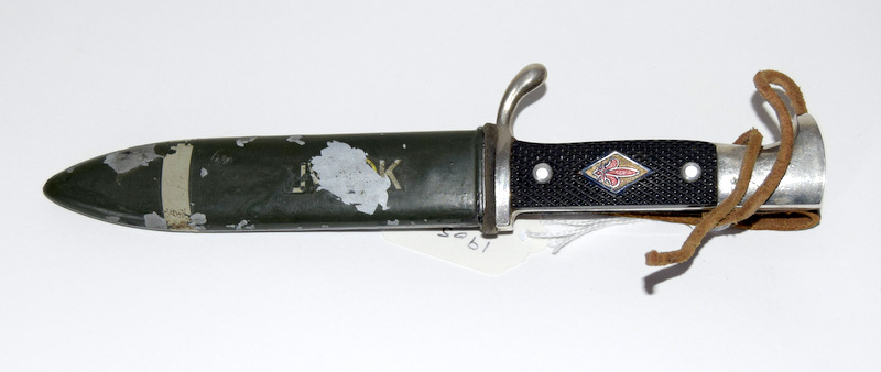 A vintage German Boy Scout knife in its steel scabbard