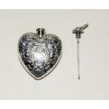 Silver heart shaped perfume bottle