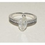 18ct white gold marquise diamond ring brilliant cut to the shoulders. Size M