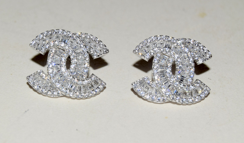 Pair of silver and cz designer style earrings