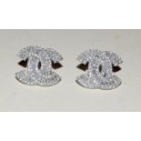 Pair of silver and cz designer style earrings