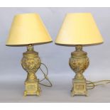 Pair of ornate gilt lamps