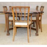 Oak draw leaf table with 6 chairs to include carvers. 75 x 184 x 106cm