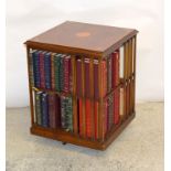 Revolving bookcase with shell motif including books. 65 x 50 x 50cm