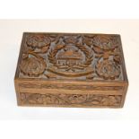 A WW1 intricately carved cigarette box with the badge of the East Lancashire Regiment complete
