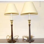 Pair of vintage bacolite candle shaped table lamps