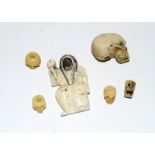 Six oriental pieces including five miniature skulls