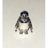 silver cast figure of a penguin