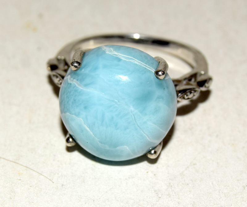 Silver fashion ring with blue set stone size Q