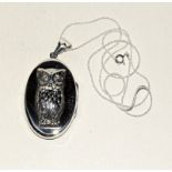 Large silver locket with embossed owl on silver chain