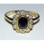 9ct gold ladies Diamond and sapphire cluster daisy ring size M