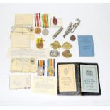 A WW1 Dorset Regiment Territorial Force medal group with WW2 medals badges etc and supporting
