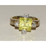 Silver fashion ring set with peridot and sapphire corner stones size M