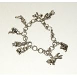 Silver charm bracelet and 7 charms