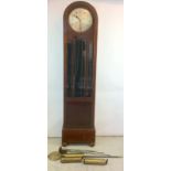 Round head grandmother striking clock in a mahogany case with weights and mechanism