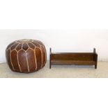 Leather pouffe and a wooden book trough