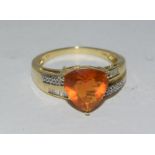 14ct yellow gold impressive trillion cut fire opal and diamond ring