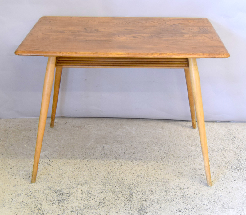 Ercol Blonde Small dining table with a fitted paper rack under ,75x100x70cm