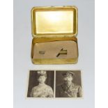 A WW1 Princess Mary tin with original bullet pencil still attached to the insert card and a WW1