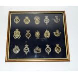 A professionally mounted collection of 15 military cap badges. Frame size 43cms x 38cms