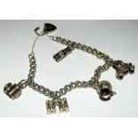 Silver charm bracelet together with 5 charms