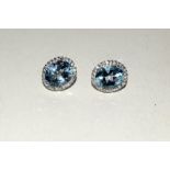 Pair of silver, CZ and aquamarine earrings