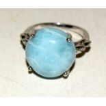 Silver fashion ring with blue set stone size Q