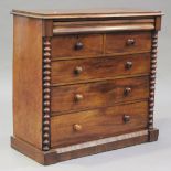 A late Victorian mahogany chest of two short and four long drawers, flanked by bobbin turned