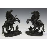 After Guillaume Coustou - a pair of late 19th century patinated cast spelter figure groups of the