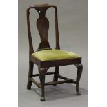 A Queen Anne walnut vase back dining chair with a drop-in seat and deep seat rail, raised on