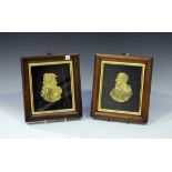 A pair of early 19th century cast gilt metal head and shoulders profile portrait plaques depicting