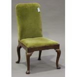 A Queen Anne walnut side chair, the upholstered seat and back above a deep seat rail, raised on